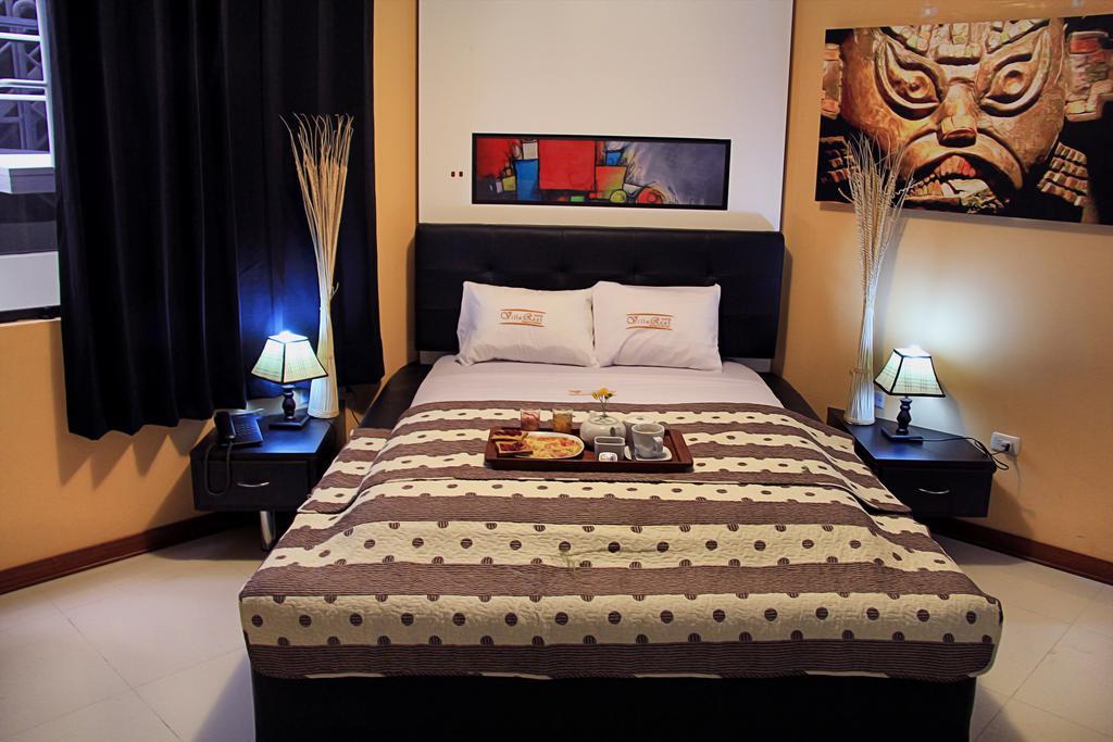 Villa Real Hotel & Suites Чиклайо Номер фото